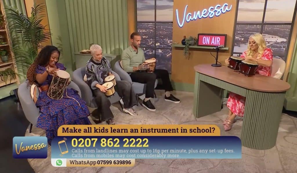 Should kids learn music? The panel plays bongos after a discussion. Left to right = Paula Rhone-Adreien, Lucy Yates (drum teacher), Calum Best and Vanessa Feltz.