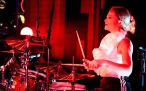 New Cross drum teacher Martha Daniels sat at her drum kit